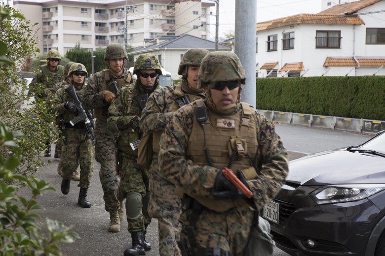 U.S. Marines and Japan Ground Self Defense Force members executed exercise Active Shield at Marine Corps Air Station Iwakuni, Japan, Nov. 10, 2016. Active Shield is an annual exercise designed to test the abilities of U.S. and Japanese forces to work alongside each other to protect and defend Marine Corps Air Station Iwakuni and other U.S. assets in the region. (U.S. Marine Corps photo by Lance Cpl. Joseph Abrego)