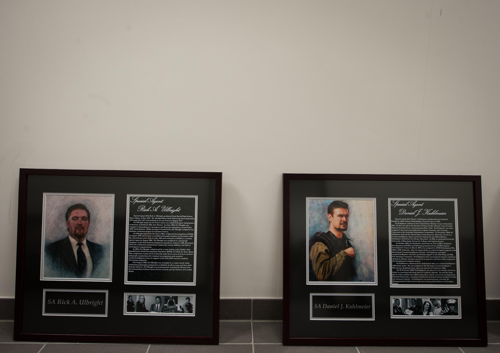 Two portraits of fallen Air Force Office of Special Investigations Airmen lay on the floor during the 25th Expeditionary Field Investigation Squadron’s fallen heroes dedication ceremony at Ramstein Air Base, Germany, Nov. 10, 2016. The 25th EFIS held the ceremony to commemorate AFOSI agents who lost their lives in the line of duty. Veteran’s Day is a celebration to honor America's veterans for their patriotism, love of country, and willingness to serve and sacrifice, even if it means their lives. According to a recent Congressional Research Service report, more than 6,500 U.S. service members have lost their lives in post-9/11 conflicts in Iraq and Afghanistan. (U.S. Air Force photo by Airman 1st Class Lane T. Plummer)