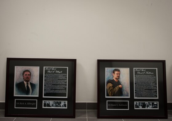 Two portraits of fallen Air Force Office of Special Investigations Airmen lay on the floor during the 25th Expeditionary Field Investigation Squadron’s fallen heroes dedication ceremony at Ramstein Air Base, Germany, Nov. 10, 2016. The 25th EFIS held the ceremony to commemorate AFOSI agents who lost their lives in the line of duty. Veteran’s Day is a celebration to honor America's veterans for their patriotism, love of country, and willingness to serve and sacrifice, even if it means their lives. According to a recent Congressional Research Service report, more than 6,500 U.S. service members have lost their lives in post-9/11 conflicts in Iraq and Afghanistan. (U.S. Air Force photo by Airman 1st Class Lane T. Plummer)