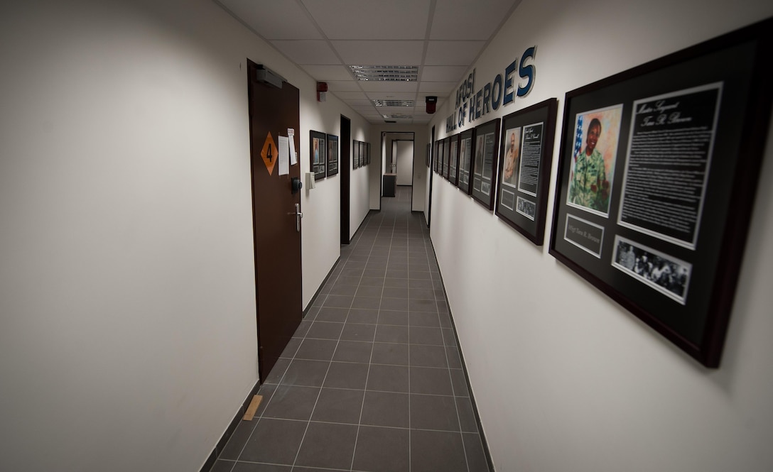 Portraits of fallen Office of Special Investigations Airmen hang from the walls of the 25th Expeditionary Field Investigation Squadron’s detachment at Ramstein Air Base, Germany, Nov. 10, 2016. The 25th EFIS constructed a “Hall of Heroes,” dedicated to remembering OSI agents who lost their lives in the line of duty. Veteran’s Day is a celebration to honor America's veterans for their patriotism, love of country, and willingness to serve and sacrifice, even if it means their lives. According to a recent Congressional Research Service report, more than 6,500 U.S. servicemembers have lost their lives in post-9/11 conflicts in Iraq and Afghanistan. (U.S. Air Force photo by Airman 1st Class Lane T. Plummer)