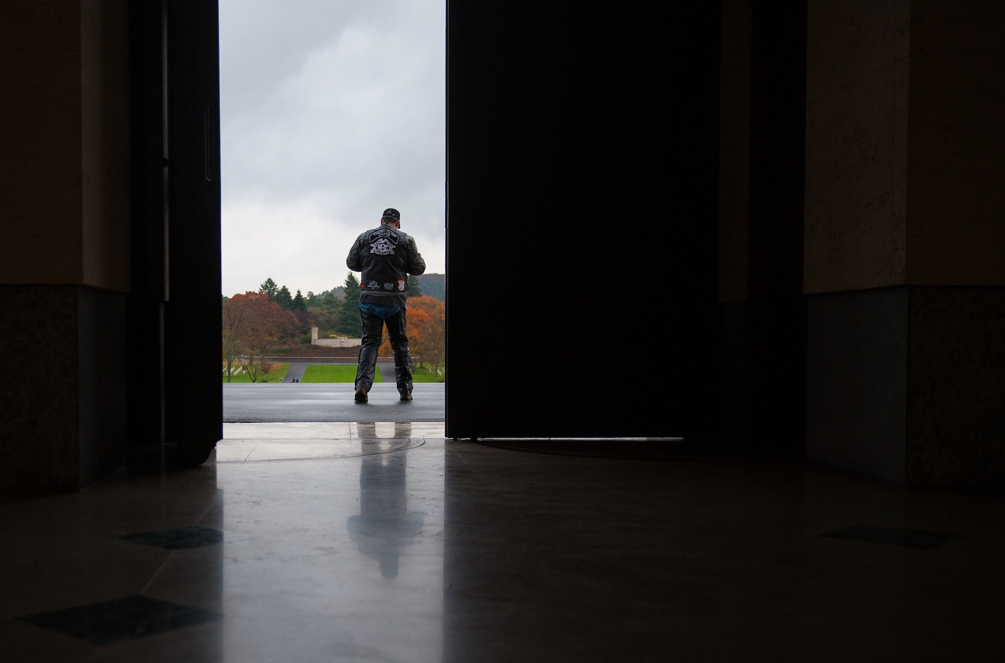 A member of the Ramstein military motorcycle club from the Kaiserslautern Military community visits the Lorraine American Cemetery to pay respect to deceased war veterans Nov. 11, 2016, at St. Avold, France. Veterans Day is observed annually on November 11 and commemorates military veterans who currently serve or have served the U.S. armed forces, including those who gave the ultimate sacrifice. According to the DoD and Veterans Administration, since World War I, approximately 624,000 U.S. servicemembers have been killed in action battling in wars and conflicts. The Lorraine American Cemetery contains the buried remains of over 10,000 of them. It is the largest burial site of U.S. servicemembers in Europe. (U.S. Air Force photo by Airman 1st Class Lane T. Plummer)