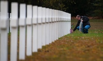 Eric Schell, a French citizen, lays a U.S. flag and flowers on the gravestone of a deceased war veteran at the Lorraine American Cemetery Nov. 11, 2016, at St. Avold, France. Veterans Day is observed annually on November 11 and commemorates military veterans who currently serve or have served the U.S. armed forces, including those who gave the ultimate sacrifice. According to the DoD and Veterans Administration, since World War I, approximately 624,000 U.S. servicemembers have been killed in action battling in wars and conflicts. The Lorraine American Cemetery contains the buried remains of over 10,000 of them. It is the largest burial site of U.S. servicemembers in Europe. (U.S. Air Force photo by Airman 1st Class Lane T. Plummer)