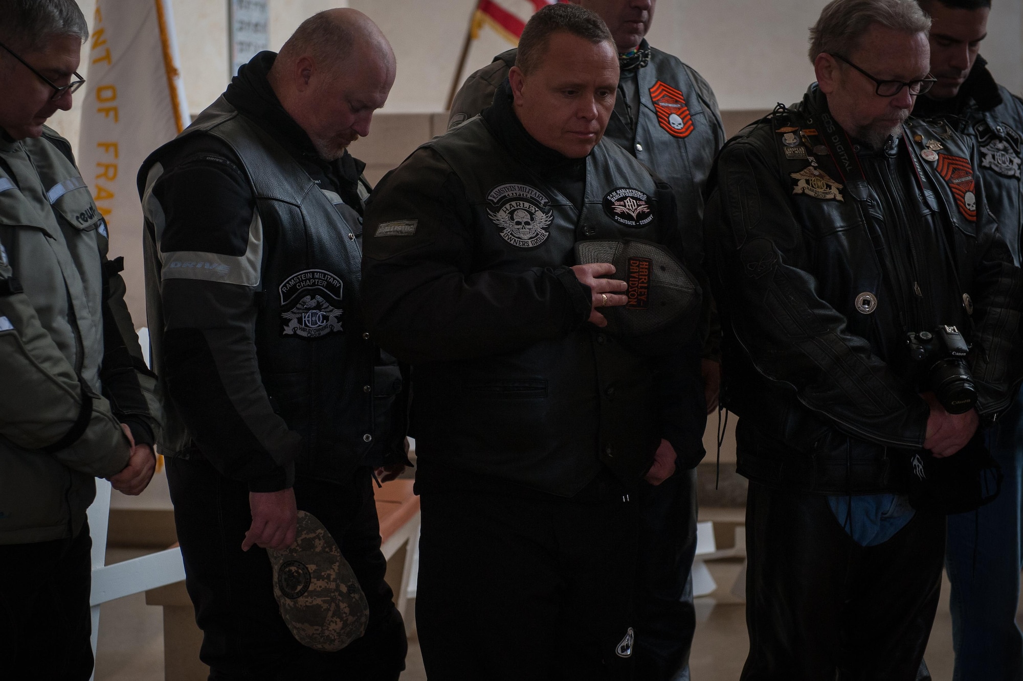 Members of the Ramstein military motorcycle club from the Kaiserslautern Military Community bow their heads in prayer as they pay respect to the fallen war veterans at Lorraine American Cemetery Nov. 11, 2016, at St. Avold, France. Veteran’s Day is observed annually on November 11 and commemorates military veterans who currently serve or have served the U.S. armed forces, including those who gave the ultimate sacrifice. According to the DoD and Veterans Administration, since World War I, approximately 624,000 U.S. servicemembers have been killed in action battling in wars and conflicts. The Lorraine American Cemetery contains the buried remains of over 10,000 of them. It is the largest burial site of U.S. servicemembers in Europe. (U.S. Air Force photo by Airman 1st Class Lane T. Plummer)