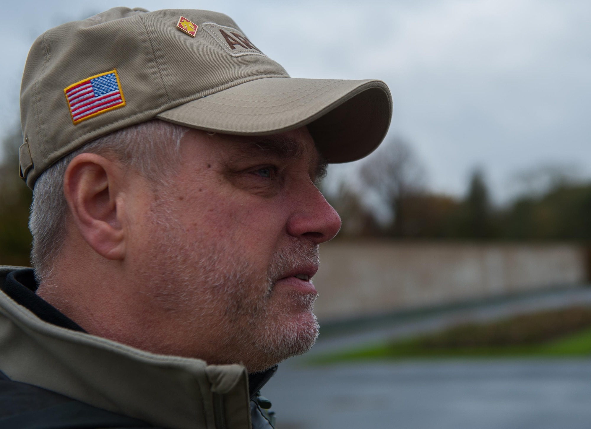Sean, a U.S. Army veteran, becomes emotional, recalling memories of his friends who died in combat, at Lorraine American Cemetery Nov. 11, 2016, at St. Avold, France. Veteran’s Day is observed annually on November 11 and commemorates military veterans who currently serve or have served the U.S. armed forces, including those who gave the ultimate sacrifice. According to the DoD and Veterans Administration, since World War I, approximately 624,000 U.S. servicemembers have been killed in action battling in wars and conflicts. The Lorraine American Cemetery contains the buried remains of over 10,000 of them. It is the largest burial site of U.S. servicemembers in Europe. (U.S. Air Force photo by Airman 1st Class Lane T. Plummer)