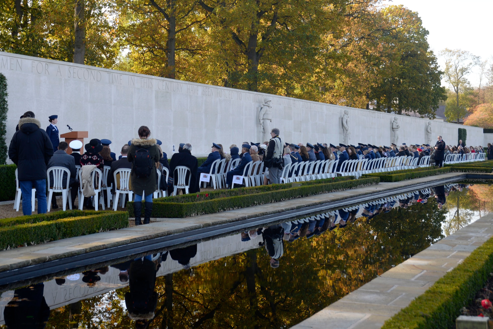 Service members and civilians attend a Veterans Day ceremony at the Cambridge American Cemetery, Cambridge, England, Nov. 11. Officially designated by President Dwight Eisenhower in 1954, Veterans Day honors all Americans who have served their country in the armed forces. (U.S. Air Force photo/Airman 1st Class Abby L. Finkel) 