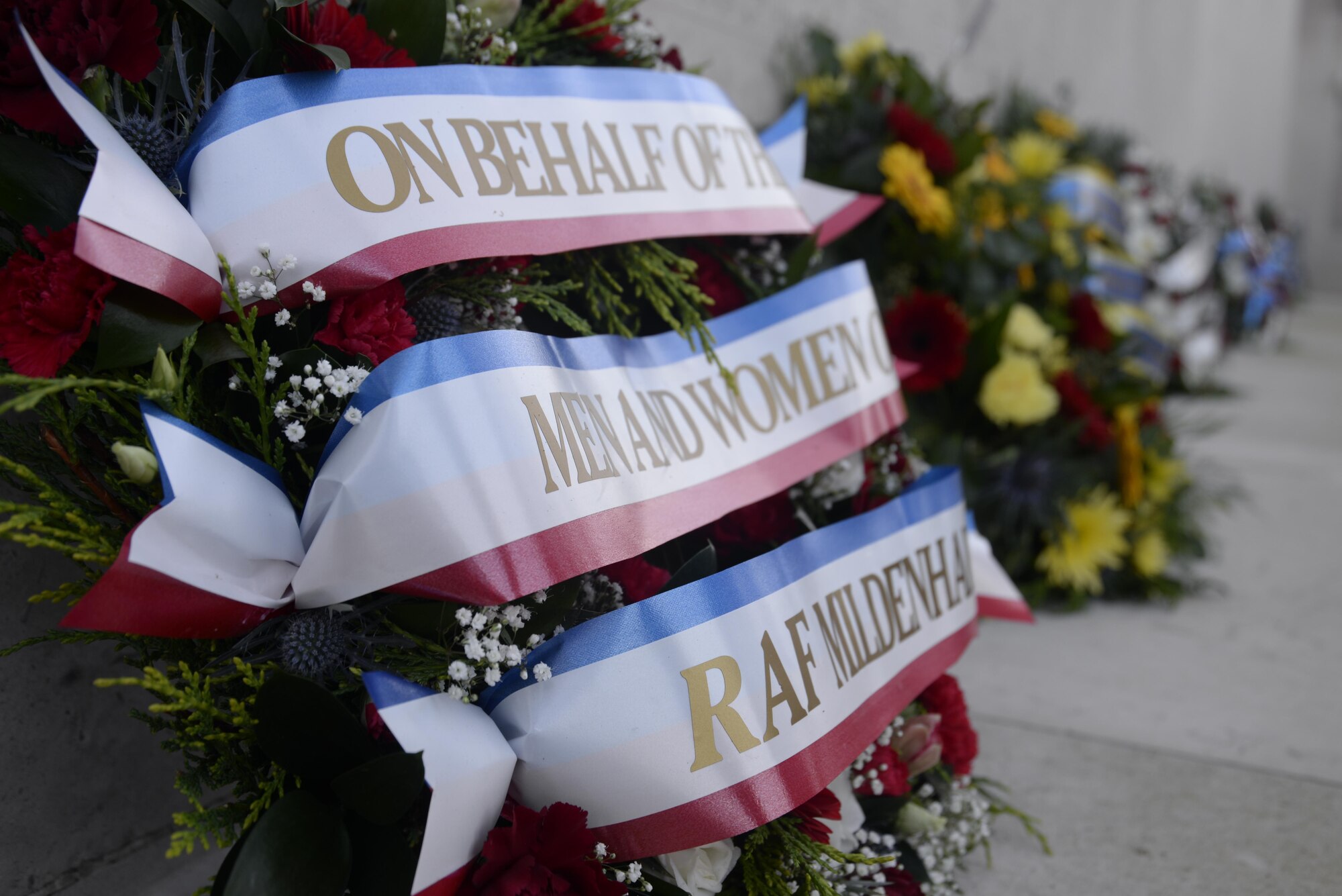 Veterans Day wreaths line the Tablets of the Missing at the Cambridge American Cemetery, Cambridge, England, Nov. 11. Distinguished visitors and veterans were invited to participate in the ceremony by placing wreathes along the Tablets of the Missing in honor the men and women who have sacrificed their lives in service to the United States. (U.S. Air Force photo/Airman 1st Class Abby L. Finkel) 