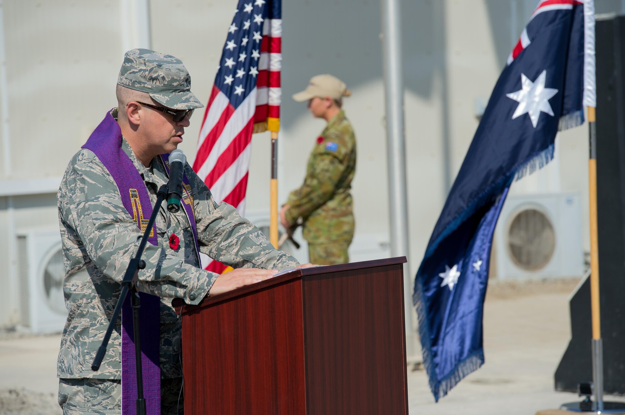 Lt Col. Michael, 380 Air Expeditionary Wing Chaplain, delivers a reading during a Coalition Veteran’s Day ceremony on Nov. 11, 2016 at an undisclosed location in Southwest Asia. “Conducting this Remembrance and Veterans' Day Service together, underscores that this high calling to authentic military service transcends any one culture or nationality, and that all those who have served such a noble purpose will be, and are, rightly honored and revered by all people of good will,” said Michael.  (U.S. Air Force photo by Senior Airman Tyler Woodward)