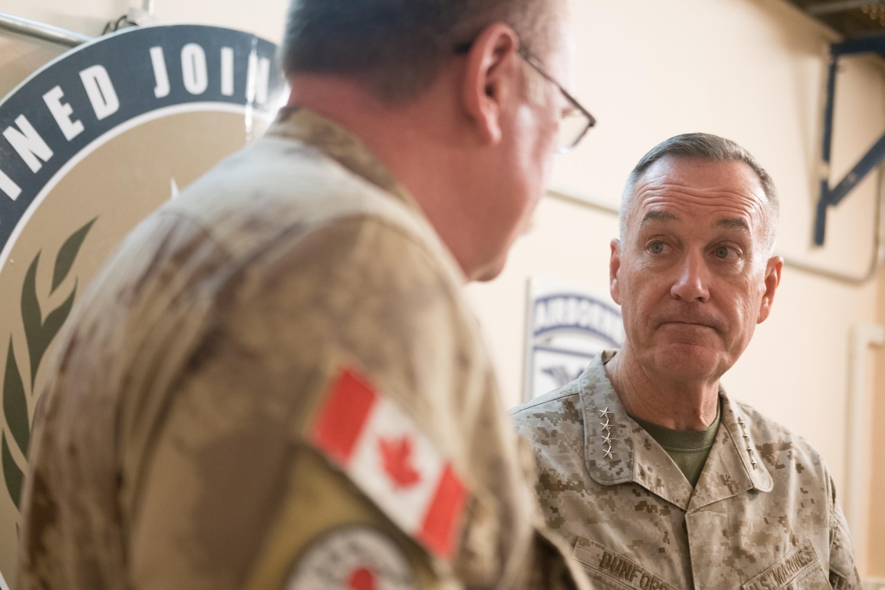 Marine Corps Gen. Joe Dunford, chairman of the Joint Chiefs of Staff, talks with military leaders at the Combined Joint Task Force Operation Inherent Resolve headquarters in Baghdad, Nov. 9, 2016. DoD photo by D. Myles Cullen