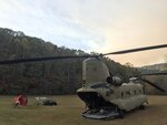 A South Carolina Army National Guard CH-47 Chinook and crew from Donaldson Field in Greenville, South Carolina support the South Carolina Forestry Commission to contain a remote fire near the top of Pinnacle Mountain in Pickens County, South Carolina. The aircraft are equipped with a Bambi Buckets, which can be filled with any available water to be transported and dumped on the fire. (U.S. Army National Guard photo by Staff Sgt. Roberto Di Giovine)