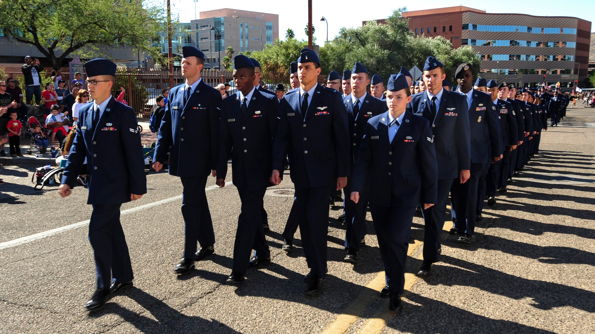U.S. Airmen from Davis-Monthan Air Force Base march in a formation during the Tucson Veterans Day Parade in Tucson, Ariz., Nov. 11, 2016. More than 100 Airmen participated in the parade, marching approximately two miles in one hour’s time. (U.S. Air Force photo by Airman Nathan H. Barbour)