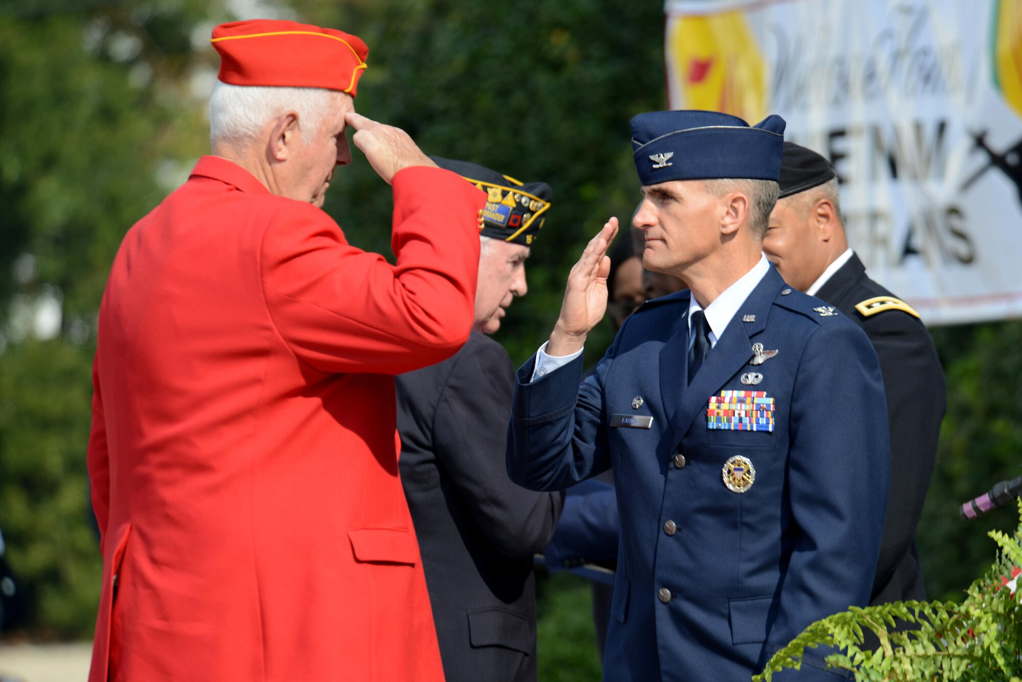 U.S. Air Force Col. Daniel Lasica, 20th Fighter Wing commander, salutes a veteran from the local community during a Veterans Day ceremony, Sumter, S.C., Nov. 11, 2016. During the ceremony, local veterans were recognized and honored for their service to the United States. (U.S. Air Force photo by Airman 1st Class Kelsey Tucker)