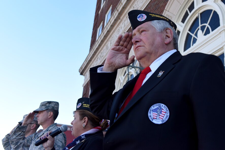 Members of Team Seymour salute during the annual Veterans Day Parade, Nov. 11, 2016, in Goldsboro, North Carolina. Veterans Day marks an opportunity to honor all men and women who serve in uniform. (U.S. Air Force photo by Airman Miranda A. Loera)