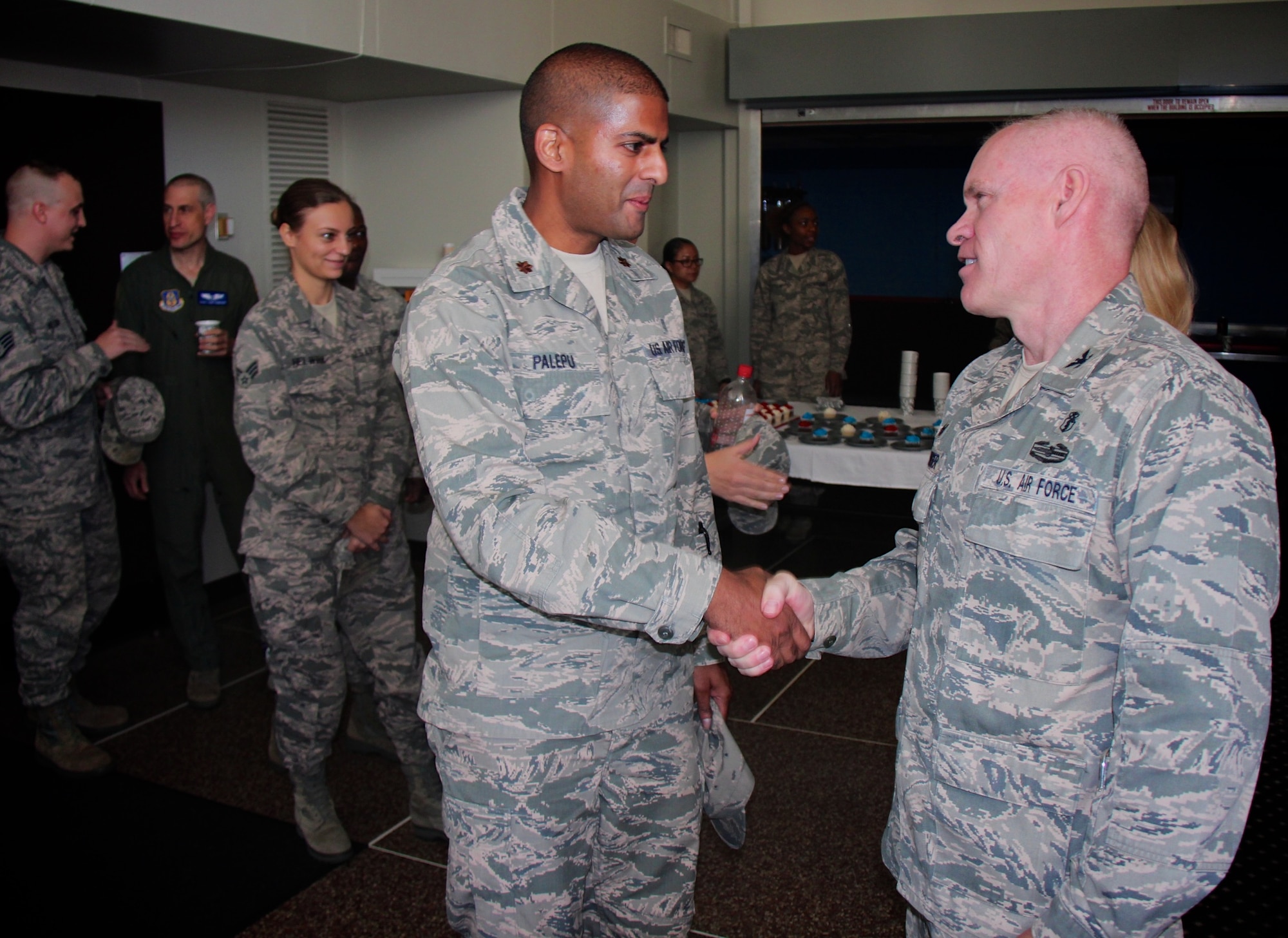 An Assumption of Command event was held during the November Unit Training Assembly.  At left, Maj. Pavan Palepu, 932nd Medical Squadron, welcomes the new 932nd Medical Group commander, Col. Leon Barringer, to the Illinois unit following his special ceremony on November 6, 2016 at Scott Air Force Base, Ill.  (U.S. Air Force photo by Lt. Col. Stan Paregien)