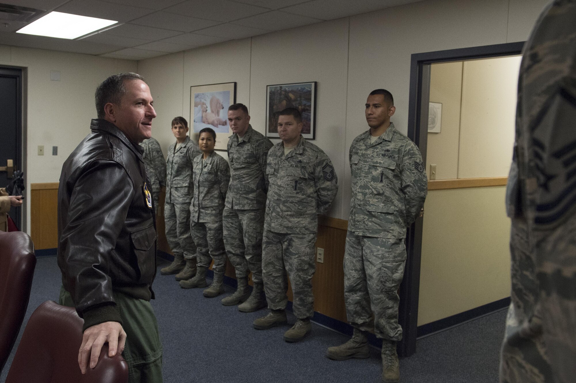 Air Force Chief of Staff Gen. David L. Goldfein speaks to exemplary Airmen after presenting them with his coin with at Joint Base Elmendorf-Richardson, Alaska, Nov. 10, 2016. During his Pacific tour, Goldfein visited JBER and shared his priorities of revitalizing squadrons, strengthening joint leaders and teams, and multi-domain command and control. 