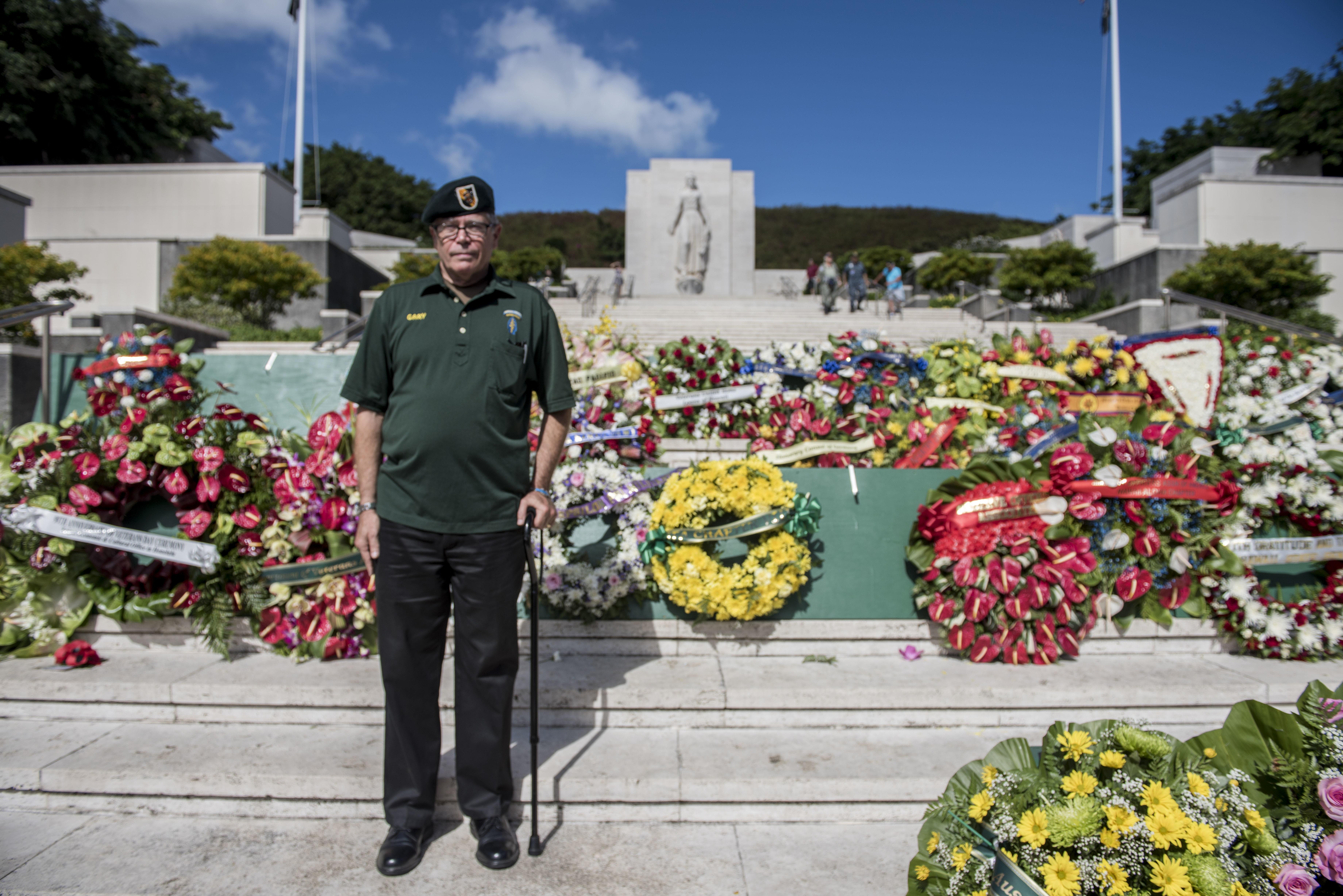 Vietnam veteran retired Air Force Col. Gary Chamberlin stands in front of the Green Beret wreath during a Veterans Day ceremony.