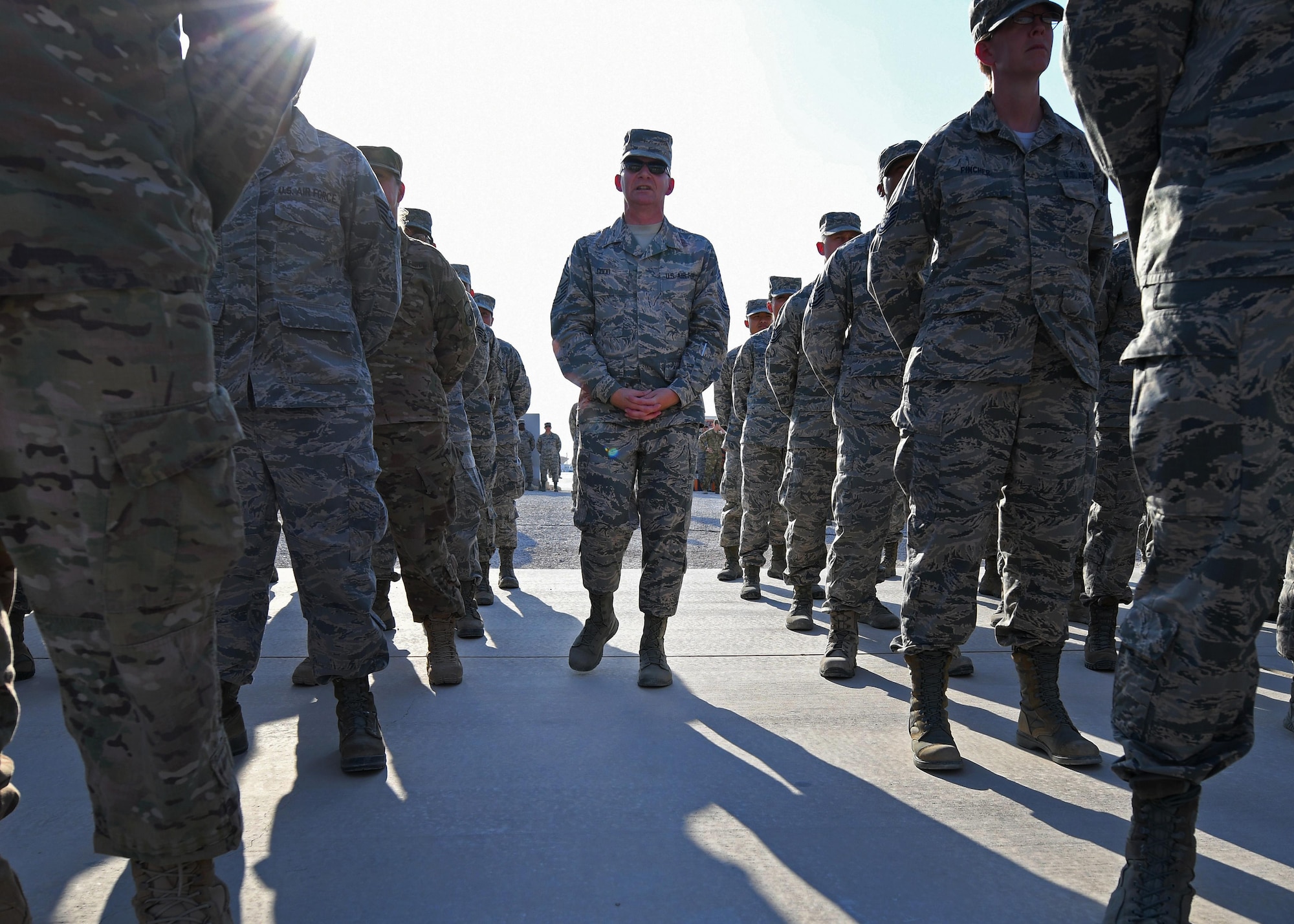 U.S. Air Force Chief Master Sgt. Thomas F. Good, 379th Air Expeditionary Wing command chief, speaks to Airmen in formation at Al Udeid Air Base, Qatar, Nov. 11, 2016. The Airmen stood in formation prior to a Veterans Day retreat ceremony, during which they retired the colors to honor all those who served and currently serve in the U.S. armed forces. (U.S. Air Force photo by Senior Airman Miles Wilson)