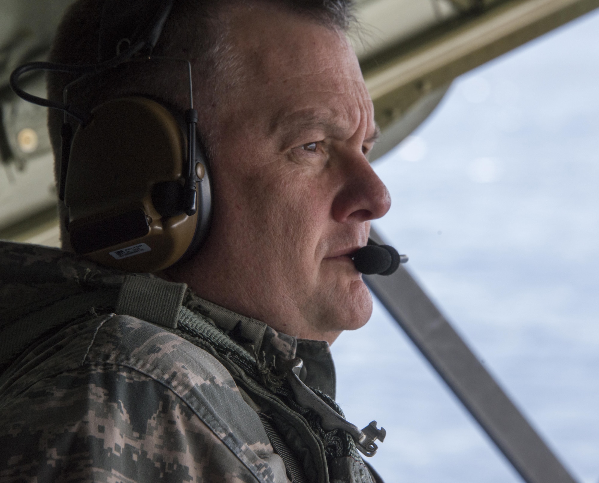 U.S. Air Force Lt. Gen. Brad Webb, commander of Air Force Special Operations Command, looks out the back of an MC-130J Commando II during an island tour of Okinawa, Japan, Nov. 7, 2016. Webb flew on the MC-130J as a part of his visit to the 353rd Special Operations Group. (U.S. Air Force photo by Capt. Jessica Tait)
