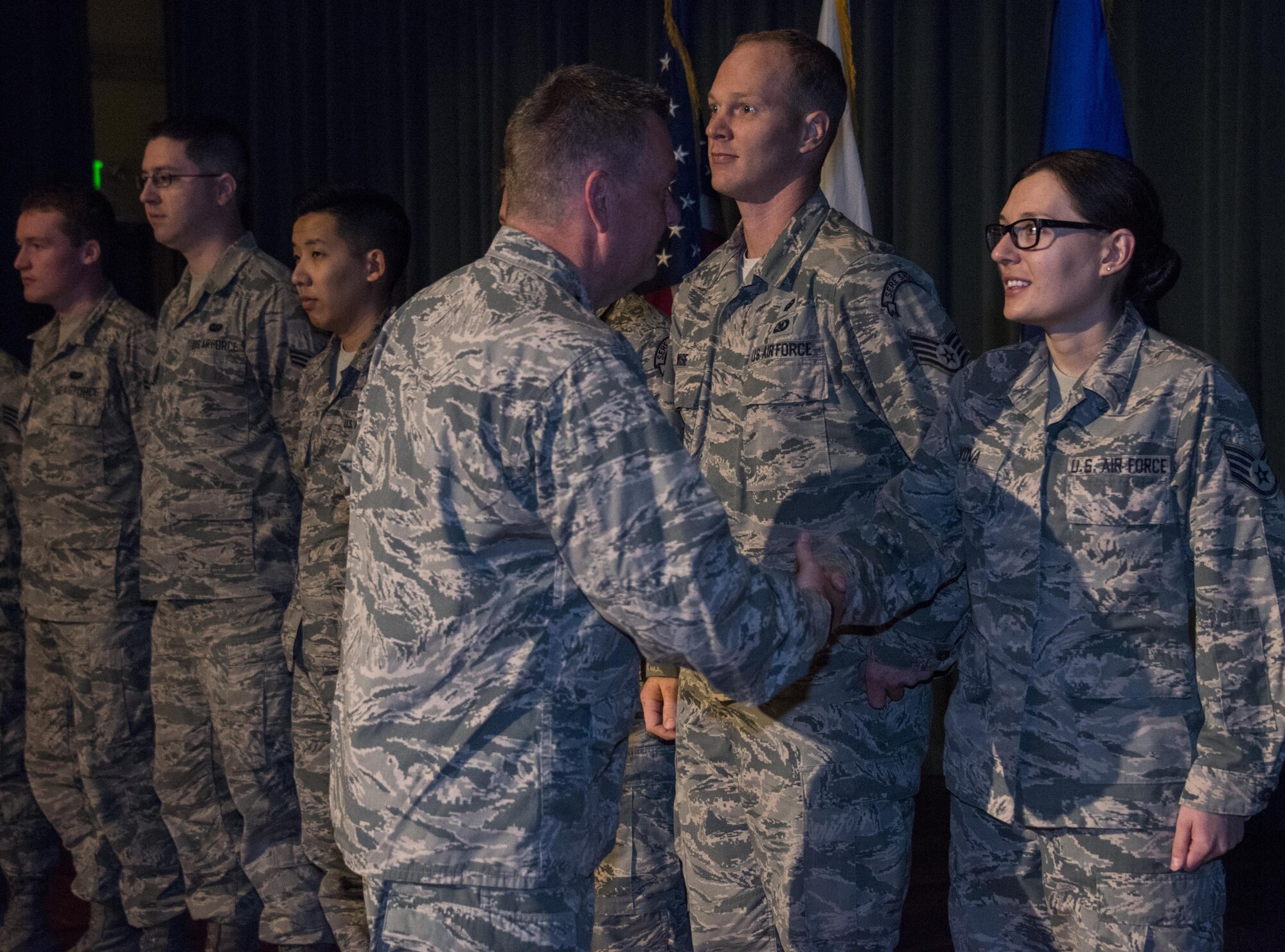 U.S. Air Force Lt. Gen. Brad Webb, commander of Air Force Special Operations Command, recognizes the innovative men and women of the 353rd Special Operations Group at an Airman all-call, Nov. 7, 2016, at Kadena Air Base, Okinawa, Japan. Supporting the AFSOC priority of relevance, the general and command chief recognized the innovated Airmen who keep special operations on the relevant end of the military spectrum. (U.S. Air Force photo by Capt. Jessica Tait)