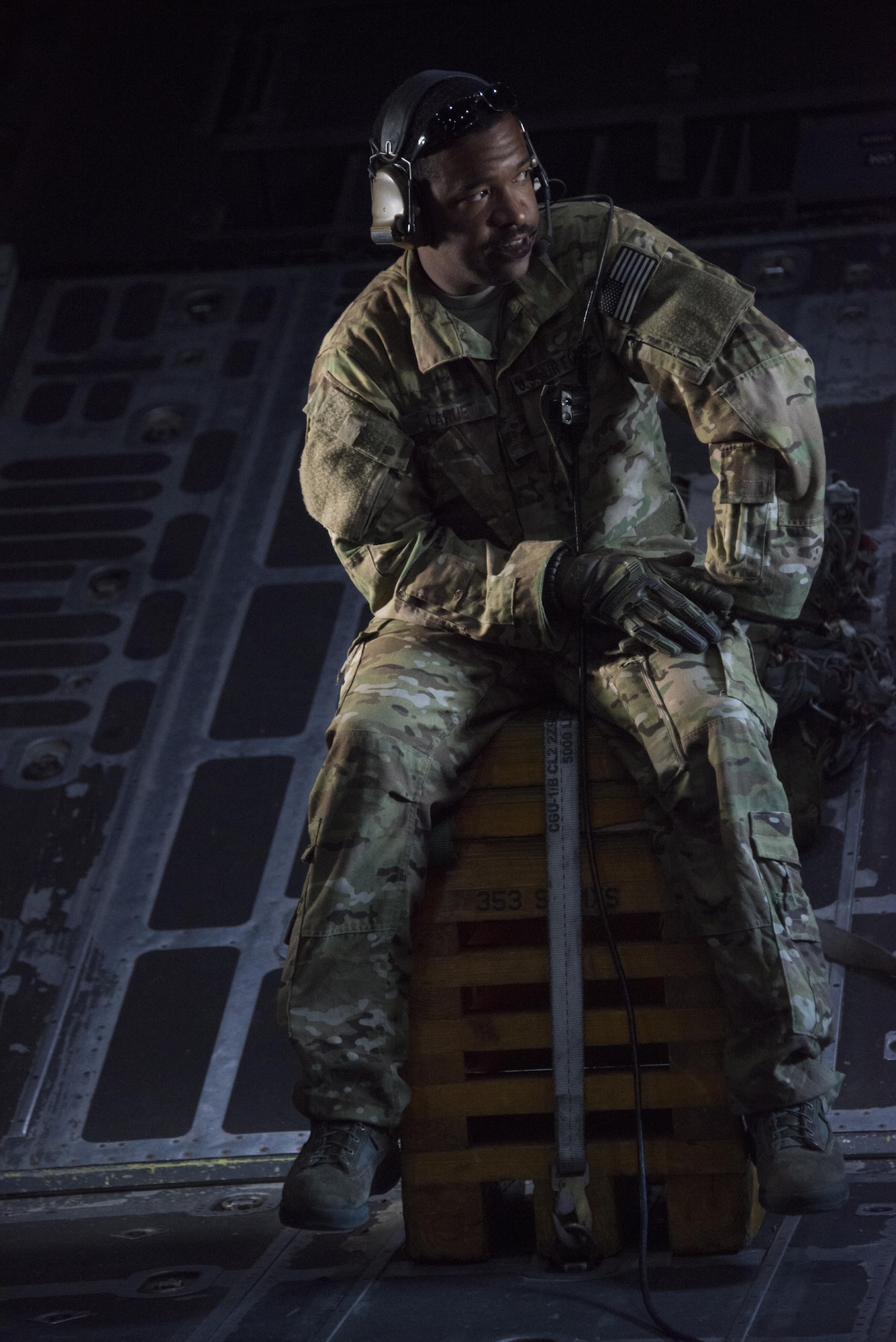 Staff Sgt. Shaun LaRue, 1st Special Operations Squadron loadmaster, sits in the back of an MC-130H Combat Talon II prior to take-off. The 1st SOS crew participated in low-level air intercept training with three F-16C Fighting Falcons from the 35th Fighter Squadron at Kunsan Air Base, Oct. 19, 2016. (U.S. Air Force photo by Capt. Jessica Tait)