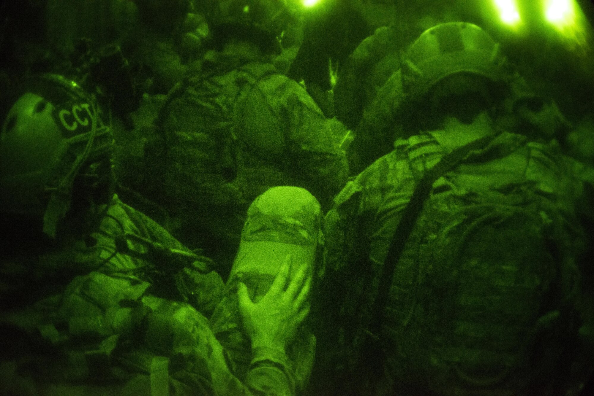 U.S. Air Force combat controllers assigned to the 320th Special Tactics Squadron and Republic of Korea (ROK) 255th Special Operations Squadron, sit in the back of an MC-130H Combat Talon II in preparation for parachute operations. Members from the 320th STS and 1st SOS worked with the ROK 255th SOS to enhance U.S. and ROK Air Force Special Operations Forces’ capabilities during a joint, combined training engagement (JCET) at Kunsan Air Base, Oct. 13-26, 2016. (U.S. Air Force photo by Capt. Jessica Tait)