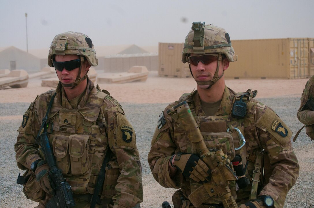 Sgt. Logon Ross, left, and Sgt. Addison Owen, right, Company B, 1st Battalion, 26th Infantry Regiment, Task Force Strike, 101st Airborne Division (Air Assault) in the U.S compound at the Qayyarah West Airfield, Iraq, Nov. 1, 2016. Company B provides security for Coalition forces on the base and was one on the first units at the location. Owen is an infantryman at the base and is on his second deployment to Iraq. On his first deployment in the city of Basra during 2010-2011, Owen was wounded when an explosively formed penetrator hit his vehicle.  (U.S. Army photo by 1st Lt. Daniel Johnson)