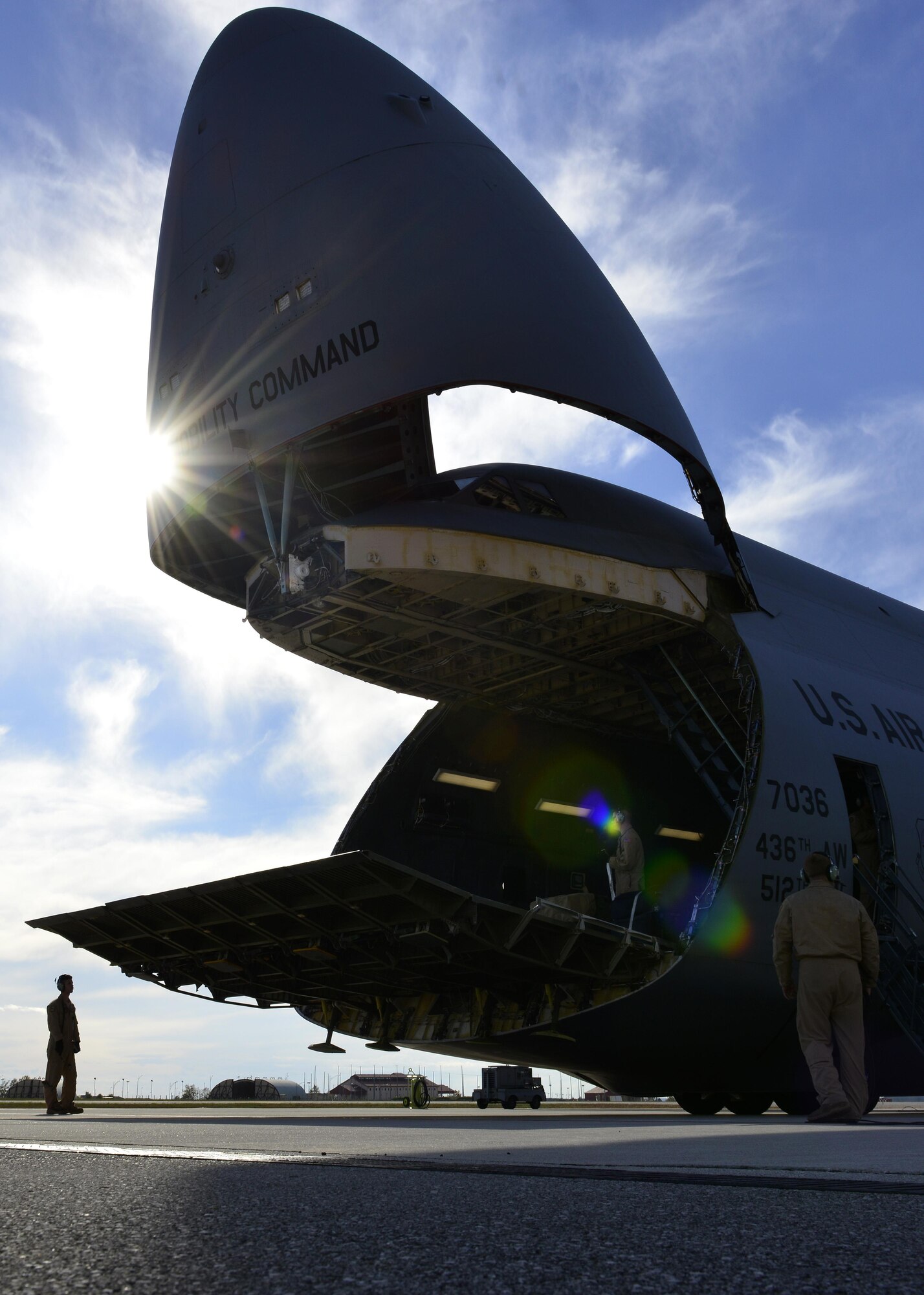 Flight crews open the nose of a C-5M Super Galaxy for cargo loading at Aviano Air Base, Italy on Nov. 8, 2016. C-5Ms can have cargo loaded through the nose or tail, and can carry more than 250,000 pounds of cargo. (U.S. Air Force photo by Senior Airman Cary Smith)