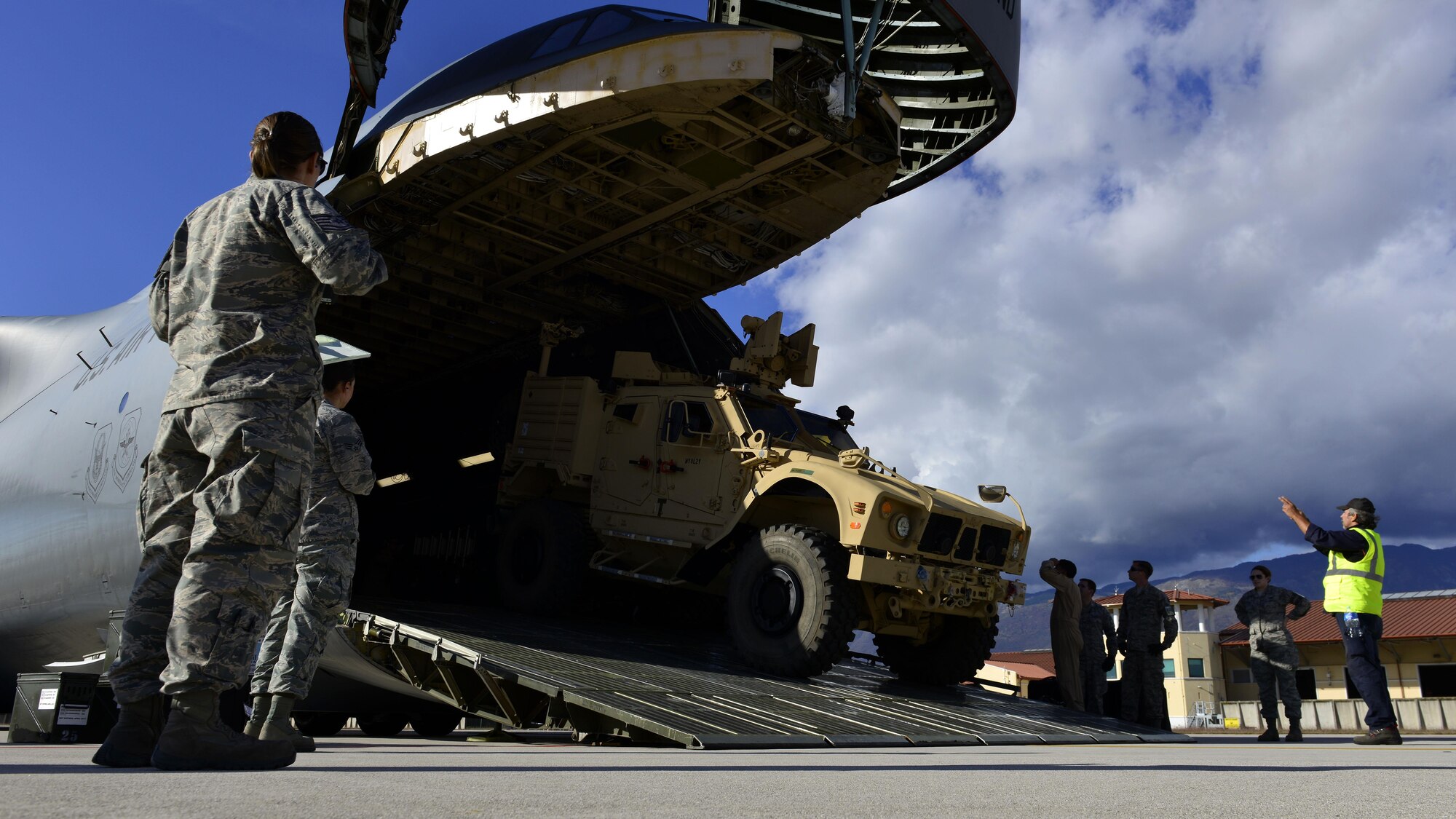 An all-terrain vehicle is backed into a C-5M Super Galaxy at Aviano Air Base, Italy on Nov. 8, 2016. The vehicles were transported to support operation efforts in Iraq. (U.S. Air Force photo by Senior Airman Cary Smith)