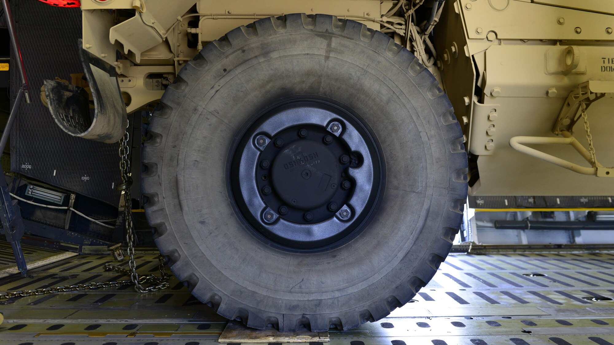 An all-terrain vehicle sits inside a C-5M Super Galaxy at Aviano Air Base, Italy on Nov. 8, 2016. The vehicles were secured with chains and supports before being transported to Iraq. (U.S. Air Force photo by Senior Airman Cary Smith)