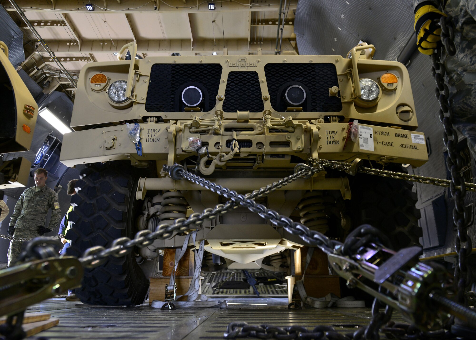 An all-terrain vehicle sits inside a C-5M Super Galaxy at Aviano Air Base, Italy on Nov. 8 2016. Several vehicles were secured with chains and supports to prevent movement during transport to Iraq. (U.S. Air Force photo by Senior Airman Cary Smith)