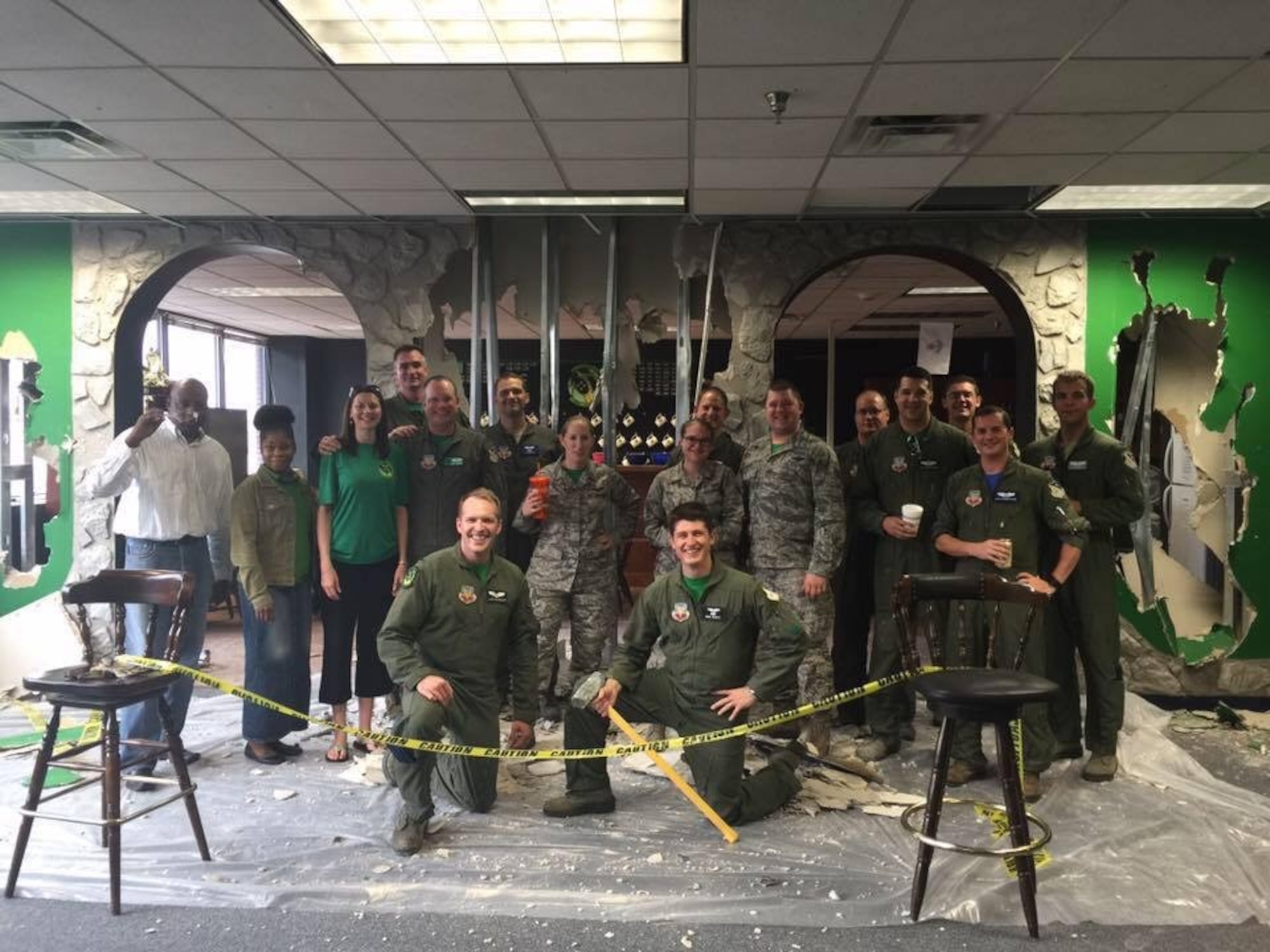 Members of the 12th Airborne Command and Control Squadron pose for a photo during a heritage room revitalization project in JSTARS operational squadron building. (U.S. Air Force photo)