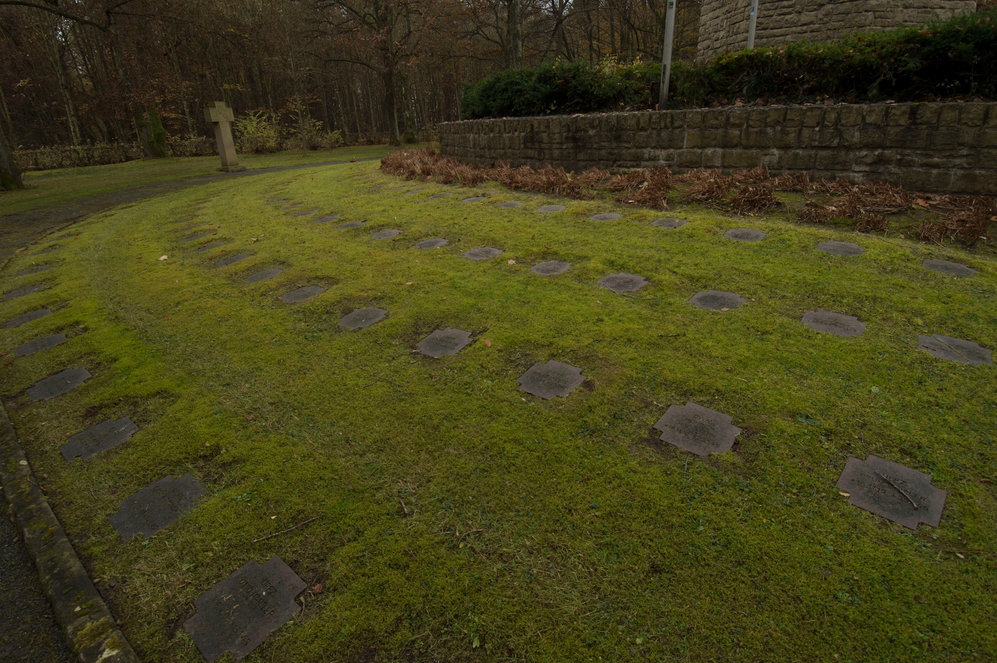 Rows of graves of German soldiers remain on display before a German National Day of Mourning observance ceremony at the Kolmeshöhe Military Cemetery in Bitburg, Germany, Nov. 13, 2016. The day, known as Volkstrauertag in German, observes the human cost of war and was established following the conclusion of the First World War. (U.S. Air Force photo by Staff Sgt. Joe W. McFadden)