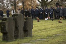 Leaders from the 52nd Fighter Wing, Spangdahlem Air Base, Germany, and German citizens pause during a German National Day of Mourning observance ceremony at the Kolmeshöhe Military Cemetery in Bitburg, Germany, Nov. 13, 2016. The day, known as Volkstrauertag in German, observes the human cost of war and was established following the conclusion of the First World War. (U.S. Air Force photo by Staff Sgt. Joe W. McFadden)