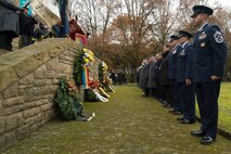 Leaders from the 52nd Fighter Wing, Spangdahlem Air Base, Germany, and German citizens pause after presenting wreaths during a German National Day of Mourning observance ceremony at the Kolmeshöhe Military Cemetery in Bitburg, Germany, Nov. 13, 2016. The day, known as Volkstrauertag in German, observes the human cost of war and was established following the conclusion of the First World War. (U.S. Air Force photo by Staff Sgt. Joe W. McFadden)
