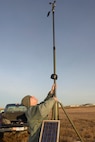 Tech. Sgt. James Pomar, 5th Operations Support Squadron missions NCO in charge, sets up tactical meteorological equipment on the airfield on Minot Air Force Base, N.D., Nov. 8, 2016. The equipment is a transportable system used as a back-up data collection source to ensure weather conditions are suitable for flight and ground operations. (U.S. Air Force photo/Airman 1st Class Jessica Weissman)