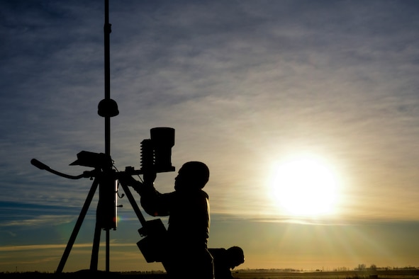 An Airman from the 5th Operations Support Squadron weather flight attaches data instruments to tactical meteorological equipment at Minot Air Force Base, N.D., Nov. 8, 2016. The weather flight supports Team Minot with weather condition updates for flight operations, weapons movements and ground operations. (U.S. Air Force photo/Airman 1st Class Jessica Weissman)