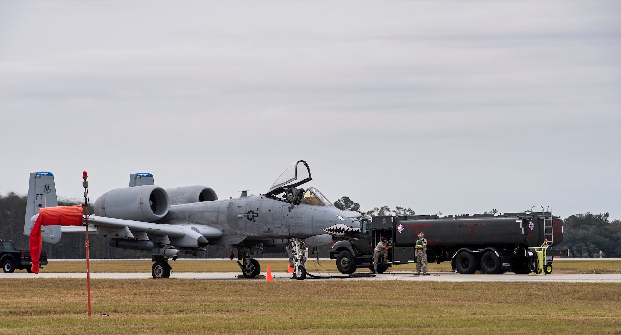 Airmen from the 23d Logistics Readiness Squadron petroleum, oil and lubricants flight perform a hot pit refuel on an A-10C Thunderbolt II, Nov. 9, 2016, at Moody Air Force Base, Ga. This type of refueling decreased the jets down time, which allowed Airmen to meet the surge’s strenuous exercise demands. (U.S. Air Force photo by Airman 1st Class Janiqua P. Robinson)