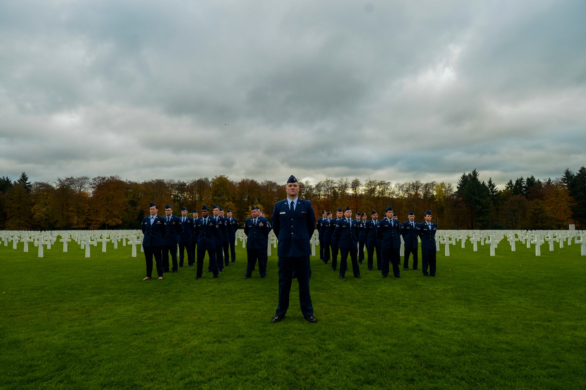 A detail of Airmen assigned to the 52nd Fighter Wing, Spangdahlem Air Base, Germany, stand at parade rest before a Memorial Day ceremony at the Luxembourg American Military Cemetery and Memorial in Luxembourg, Nov. 11, 2016. The ceremony paid tribute to the legacy of service of members of the American armed forces. (U.S. Air Force photo by Staff Sgt. Joe W. McFadden)