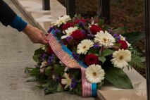 David McKean, U.S. Ambassador to the Grand Duchy of Luxembourg, adjusts a wreath during a Memorial Day ceremony at the Luxembourg American Military Cemetery and Memorial in Luxembourg, Nov. 11, 2016. The ceremony paid tribute to the legacy of service of members of the American armed forces. (U.S. Air Force photo by Staff Sgt. Joe W. McFadden)