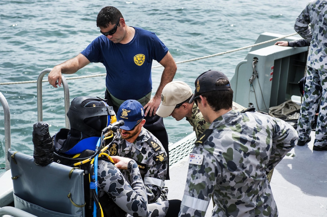 U.S. Navy divers assigned to Mobile Diving Salvage Unit 1 and Royal Australian Navy divers conduct supervisor checks before a surface-supplied dive during Exercise Dugong 2016, in Sydney, Nov. 8, 2016. Dugong is a bilateral U.S and Australian training exercise that advances tactical level U.S. service component integration, capacity and interoperability with Australian Clearance Diving Team 1. Navy photo by Petty Officer 1st Class Arthurgwain L. Marquez