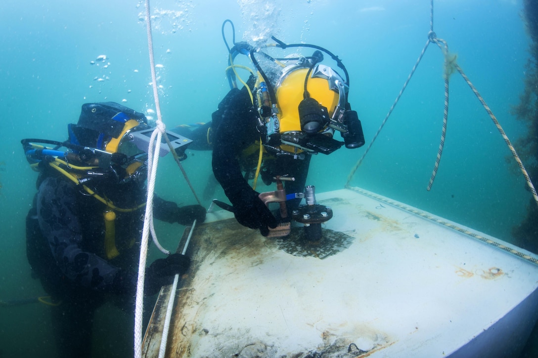 Navy Petty Officer 3rd Class Sean Black participates in underwater welding exercise during Exercise Dugong 2016 near Sydney, Nov. 9, 2016. Black is assigned to Mobile Diving Salvage Unit 1. Navy photo by Petty Officer 1st Class Arthurgwain L. Marquez