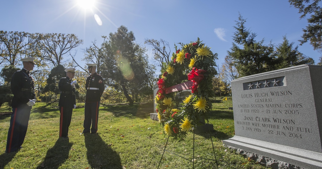 Commandant of the Marine Corps Gen. Robert B. Neller, center, speaks to a U.S. Marine at Arlington National Cemetery, Arlington, Va., Nov. 10, 2016. Neller visited the cemetery to lay a wreath at the grave of Gen. Louis H. Wilson, Jr., 26th commandant of the Marine Corps.