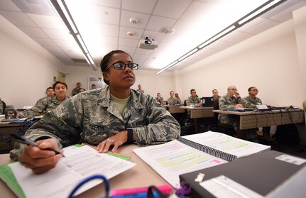 Airman 1st Class Celenia Hoffman, an Air Force Dental Assistant Apprentice Course trainee, listens to a lesson at the Medical Education and Training Campus on Joint Base San Antonio-Fort Sam Houston, Oct. 20, 2016. Trainees who graduate from the course, gain the knowledge and skills necessary to perform as entry-level dental assistants. All students are assigned to the 381st Training Squadron, a unit of the 59th Training Group.  (U.S. Air Force photo/Staff Sgt. Jerilyn Quintanilla)