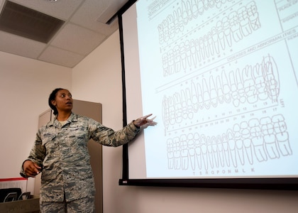 Tech. Sgt. Christy Nixon, an Air Force Dental Assistant Apprentice Course instructor, conducts a lesson at the Medical Education and Training Campus on Joint Base San Antonio-Fort Sam Houston, Oct. 20, 2016. The 9-week technical training course is designed to give students the knowledge and skills necessary to perform their job in the operational Air Force. Nixon is assigned to the 381st Training Squadron, a unit of the 59th Training Group. (U.S. Air Force photo/Staff Sgt. Jerilyn Quintanilla)