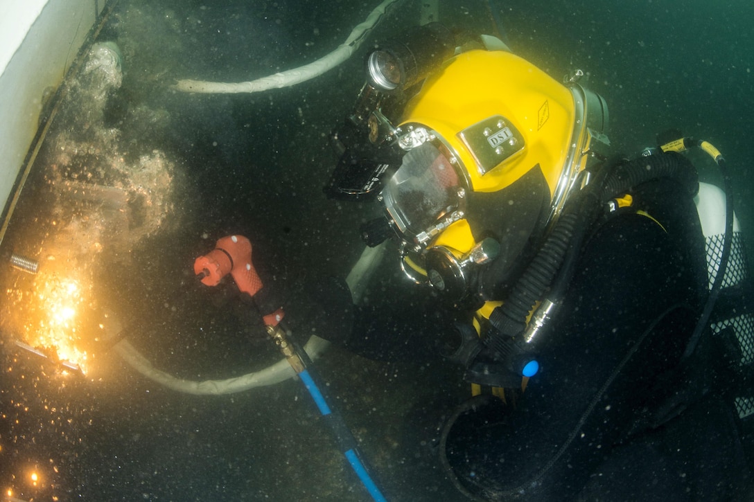 Navy Petty Officer 2nd Class Jacob Rasmussen practices underwater welding skills practices underwater welding skills during Exercise Dugong 2016 near Sydney, Nov. 9, 2016. Rasmussen is assigned to Mobile Diving Salvage Unit 1. Navy photo by Petty Officer 1st Class Arthurgwain L. Marquez