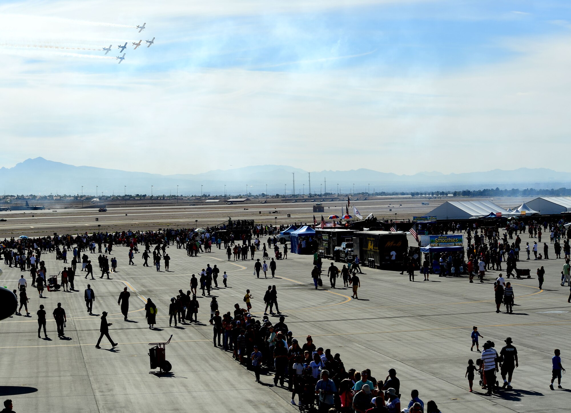 Spectators enjoy an aerial demonstration during Aviation Nation Nov. 12, 2016, at Nellis Air Force Base, Nevada. The base hosted more than 300,000 people during the air show. (U.S. Air Force photo by Senior Airman Christian Clausen/Released)