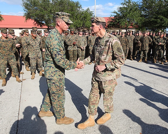 U.S. Army General Joseph L. Votel, commander of U.S. Central Command met with Lieutenant General William D. Beydler, Commander U.S. Marine Corps Forces, Central Command, at MacDill Airforce Base on November 8.
General Votel visited the MARCENT Headquarters for a staff brief and tour of the facility. Additionally he recognized six MARCENT Marines for superior performance in their duties and provided them each one of his 4-star challenge coins.