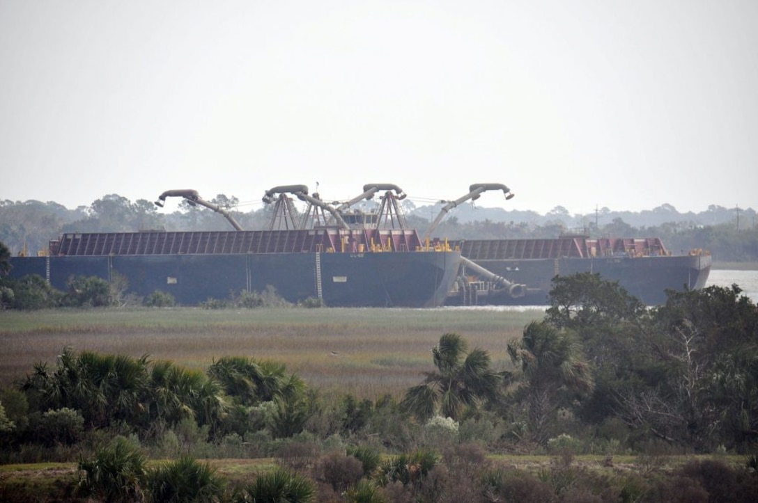 A spider barge and two scow vessels sit idle in the Savannah River’s South Channel near Fort Pulaski, Nov. 1, while the Dredge Illinois works on the other side of Cockspur Island. 