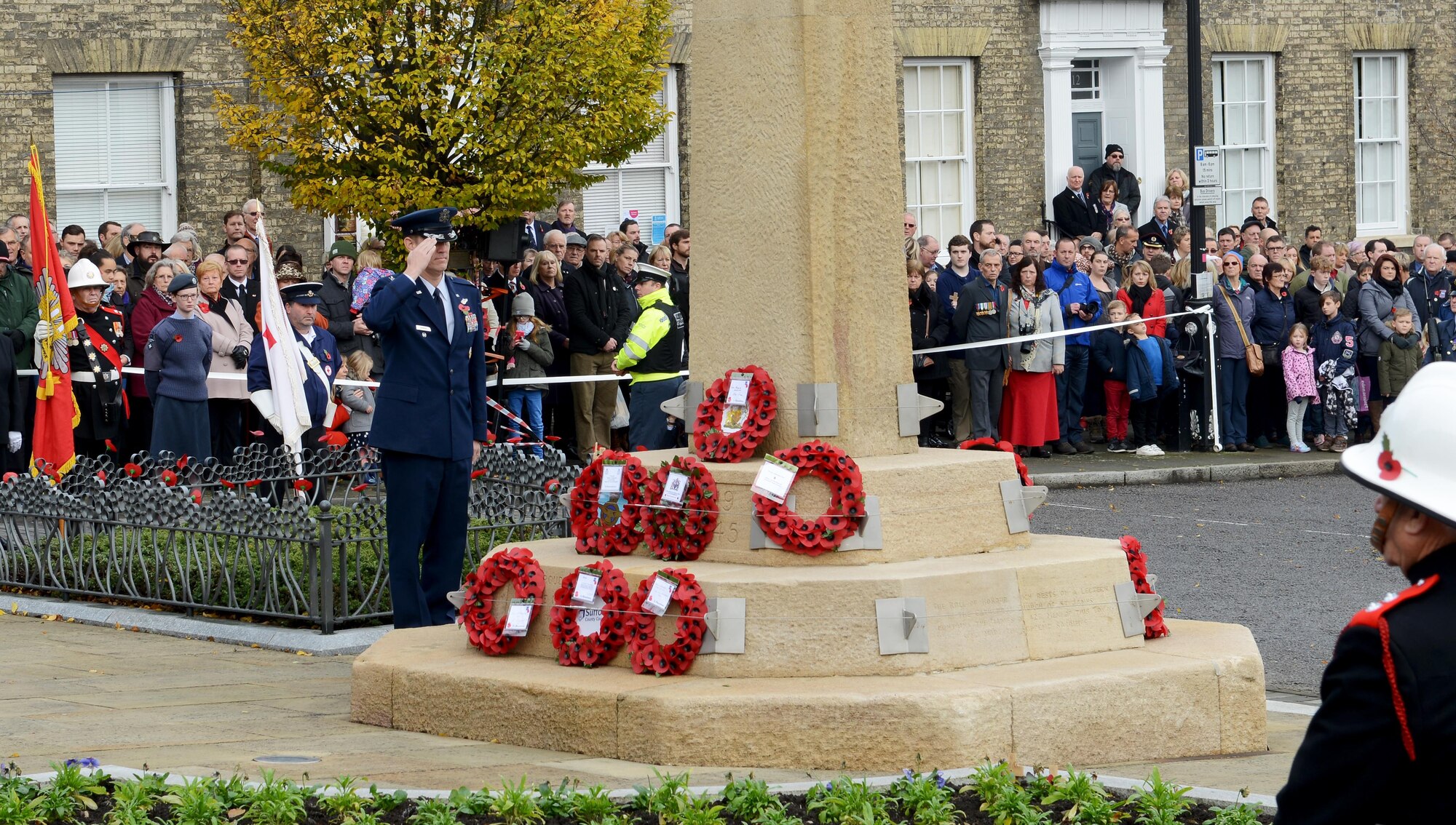 U.S. Air Force Col. John Howard, 100th Air Refueling Wing vice commander, salutes the memorial on Angel Hill during a wreath-laying ceremony Nov. 13, 2016, in Bury St. Edmunds, England. Remembrance Sunday was originally named Armistice Day after World War I, which ended at the 11th hour on the 11th day of the 11th month in 1918. The day was changed to Remembrance Sunday after World War II to honor all of the men and women who died serving their country. (U.S. Air Force photo by Staff Sgt. Richard Ware)   