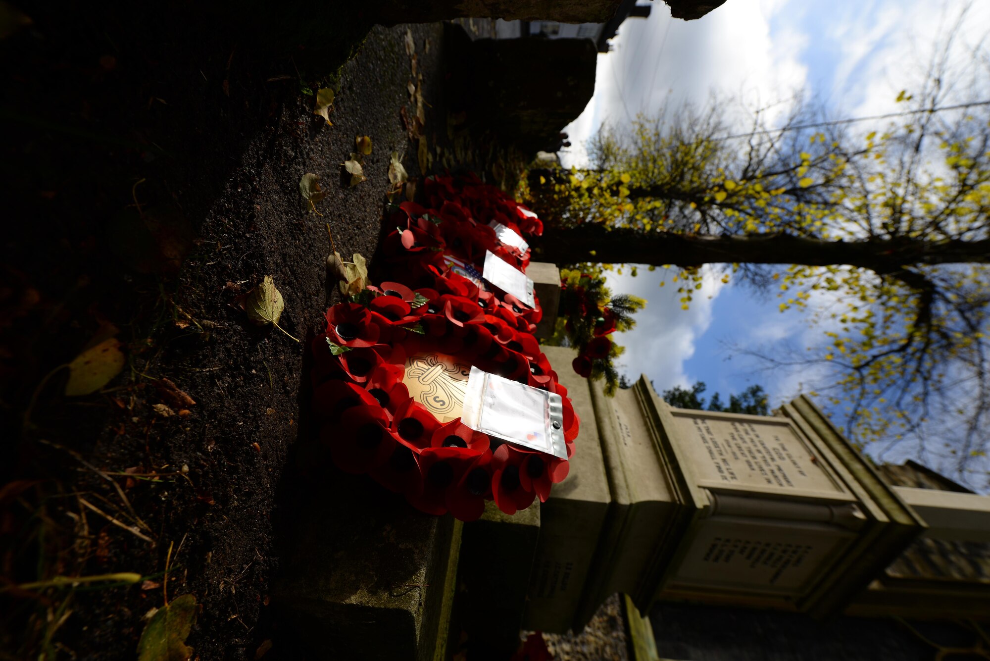Wreaths lay at the base of a memorial after a Remembrance Sunday ceremony Nov. 13, 2016, in Dickleburgh, England. The poppy was chosen as the symbol of remembrance because many British soldiers lost their lives in the poppy fields of Flanders, Belgium, during World War I. (U.S. Air Force photo by Staff Sgt. Micaiah Anthony)