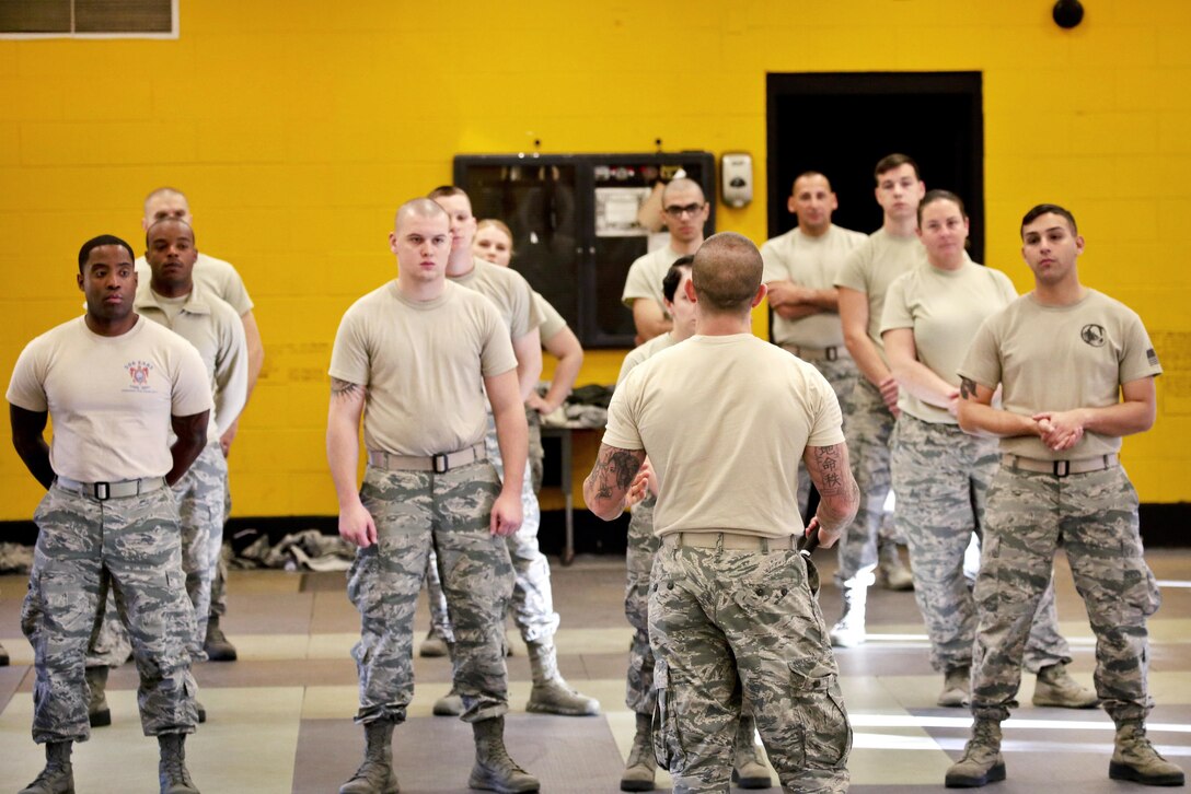 Air Force Master Sgt. Michael Mastrangelo, center foreground, gives a safety and training brief before airmen participate in less-than-lethal baton skills training at Joint Base McGuire-Dix-Lakehurst, N.J., Nov. 6, 2016. Mastrangelo and the airmen are assigned to the New Jersey Air National Guard's 108th Security Forces Squadron. Air National Guard photo by Tech. Sgt. Matt Hecht